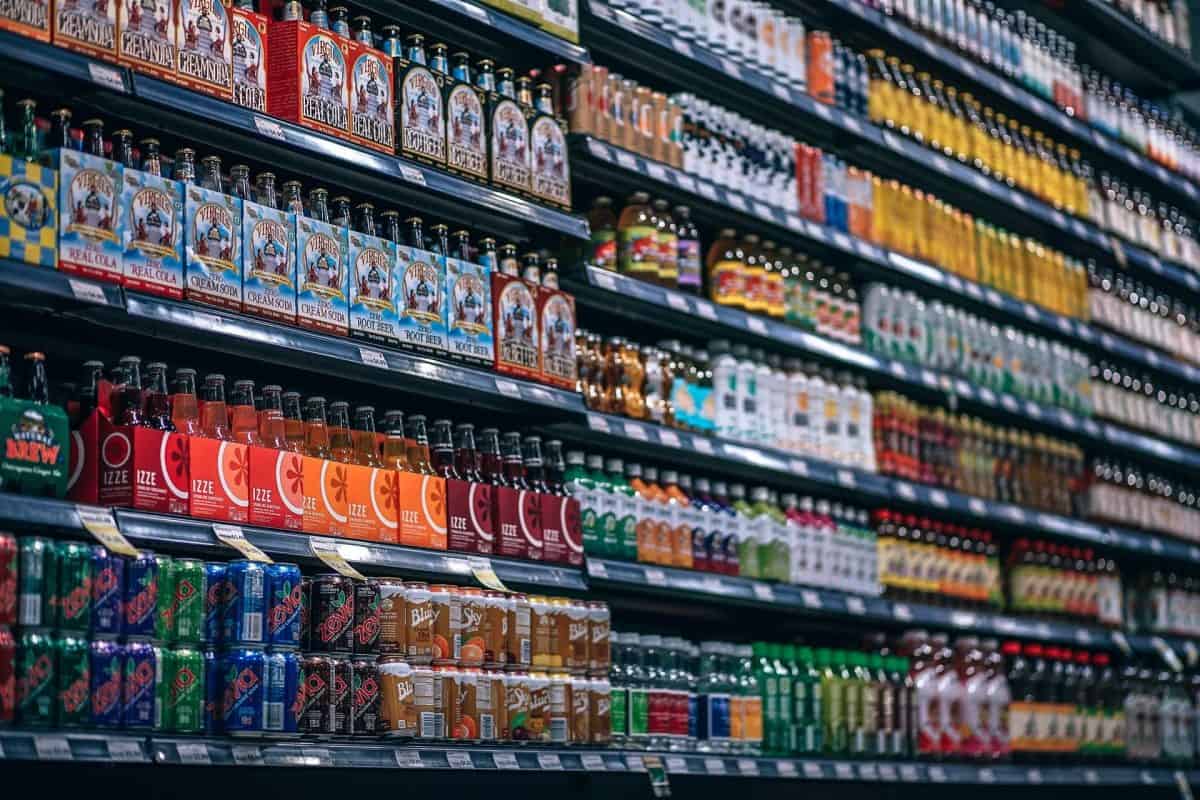 Grocery store aisle with soda.