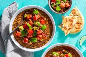 Ethiopian red lentil stew with berbere tomato salad and toasted naan