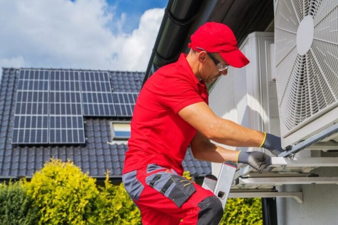 Hvac worker performing heat pump maintenance 2022 12 16 11 43 36 utc