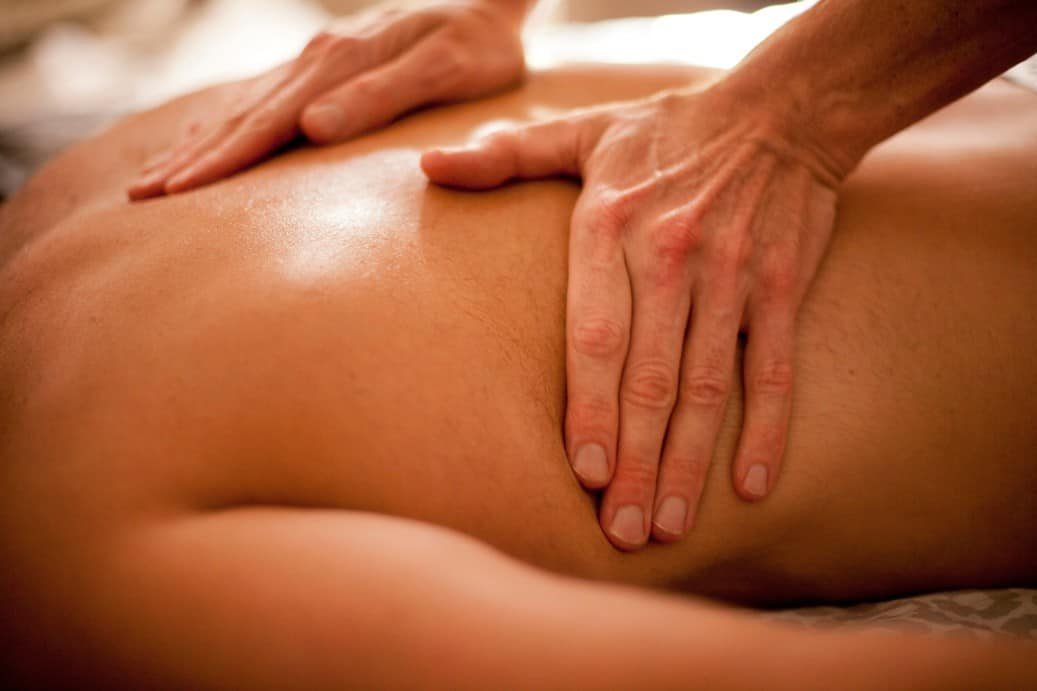 spa time relaxing and soothing massage hands of a professional massage therapist young shirtless t20 eoKvLo